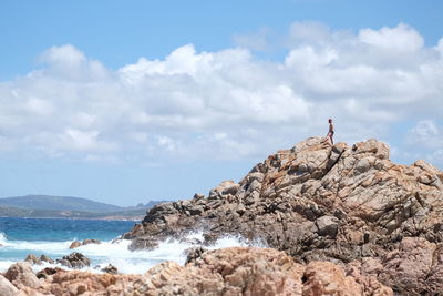 Scenic view of rocks on land against sky