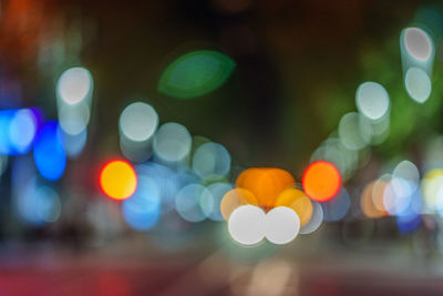 Defocused image of illuminated lights at night