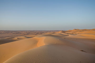 Scenic view of desert against clear sky