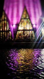 Reflection of illuminated lights on mirror