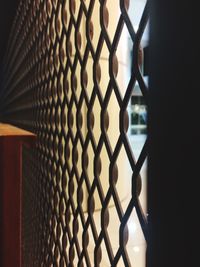 Close-up of chainlink fence against sky