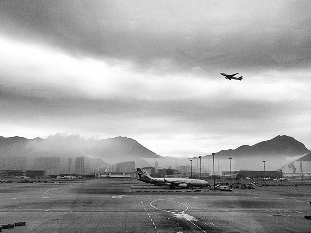 transportation, mode of transport, flying, sky, airplane, cloud - sky, air vehicle, land vehicle, car, mid-air, on the move, cloudy, travel, mountain, cloud, nature, day, outdoors, journey, road