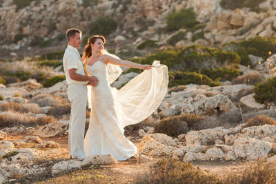 Young couple standing on rock