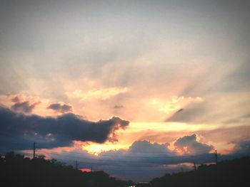 Scenic view of cloudy sky at sunset