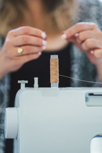 Cropped hands of woman working in workshop