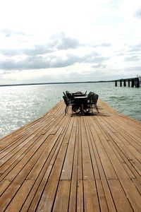 Pier over sea against sky