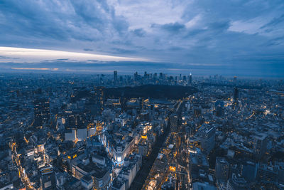 Aerial view of city buildings against sky