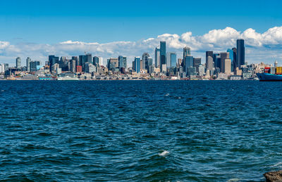 Scenic view of sea against sky in city