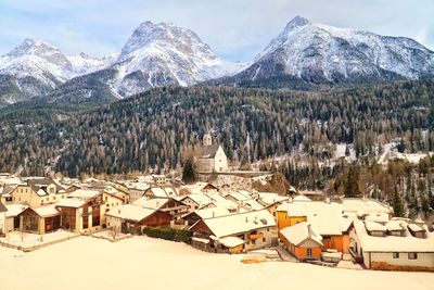 Panoramic view of townscape and snowcapped mountains