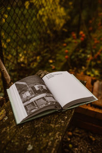 Close-up of open book on field
