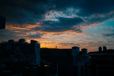 Cityscape against sky during sunset