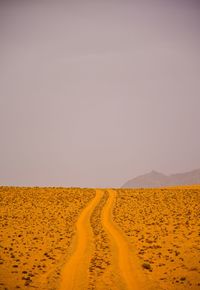 Scenic view of desert against clear sky