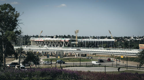 View of bridge in city against sky