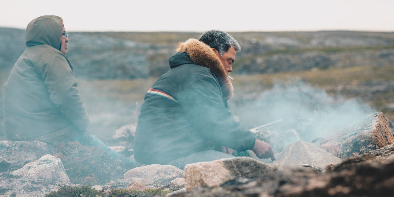 real people, two people, nature, clothing, warm clothing, men, mountain, people, leisure activity, rock, sky, day, winter, adult, solid, waist up, rock - object, environment, sitting, water, outdoors