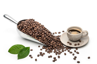 Coffee cup and cookies against white background