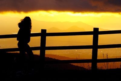 Silhouette of people at sunset