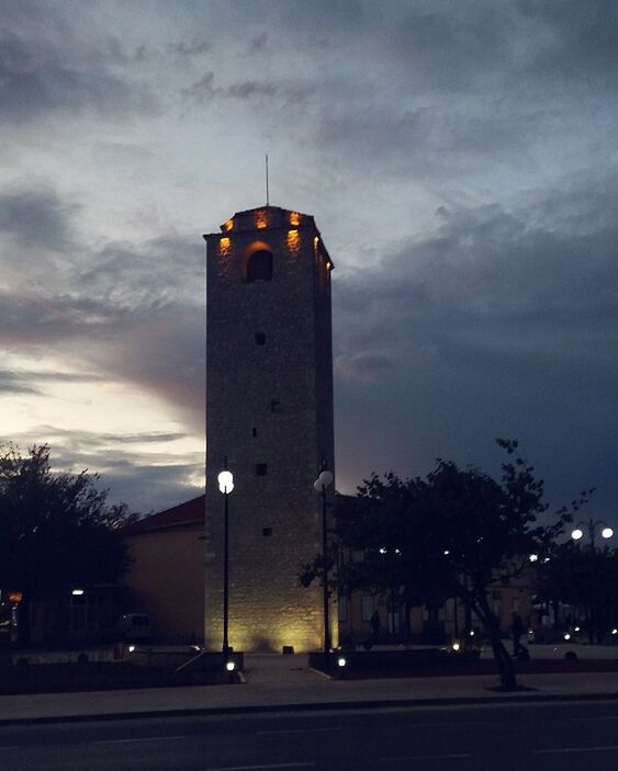 LOW ANGLE VIEW OF ILLUMINATED BUILDING AGAINST SKY