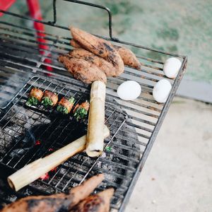 High angle view of meat on barbecue grill