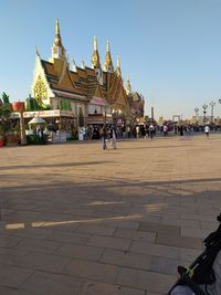 Group of people in temple outside building