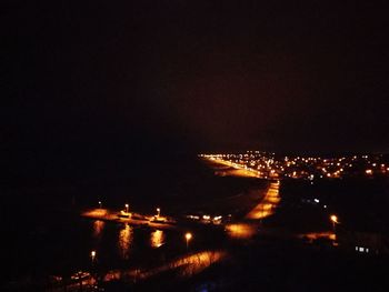 High angle view of illuminated buildings in city at night