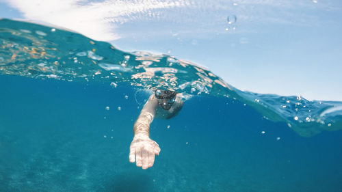 Man swimming in sea