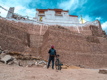 Rear view of man working at construction site