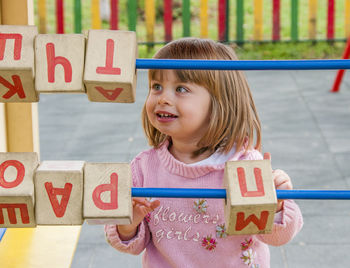 Happy girl playing with toy