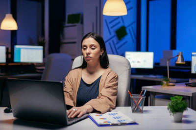 Tired businesswoman working in office
