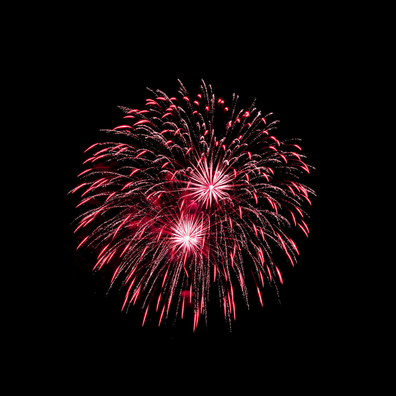 fireworks, celebration, firework display, night, exploding, event, motion, arts culture and entertainment, illuminated, glowing, sky, low angle view, recreation, no people, nature, firework - man made object, multi colored, long exposure, red, copy space, dark, outdoors, blurred motion, black and white, black