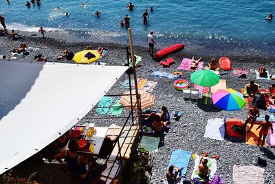 High angle view of people enjoying at beach