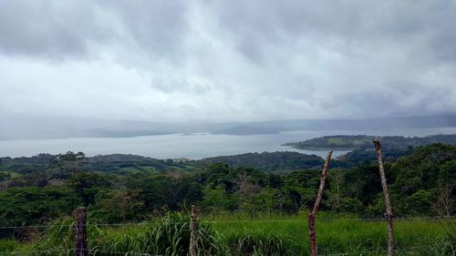 View of calm sea against cloudy sky