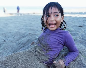 Portrait of a smiling girl on beach