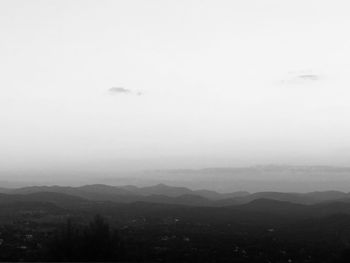 Scenic view of silhouette mountains against sky