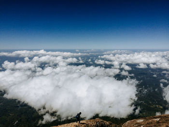 Scenic view of clouds over landscape against sky