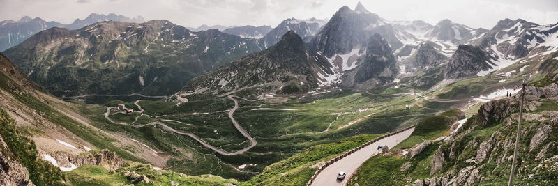 Panoramic shot of road amidst mountains against sky