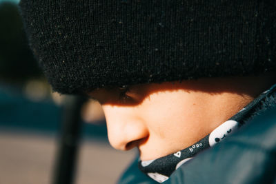 Close-up portrait of boy wearing hat