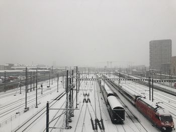 High angle view of snow covered railroad tracks against sky