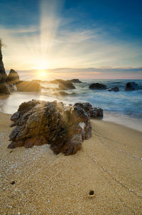 Scenic view of sea against sky during sunset