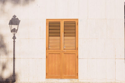 Closed window on white wall of building