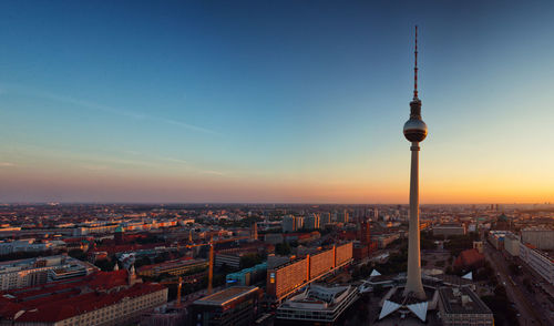 View of fernsehturm against sky during sunset