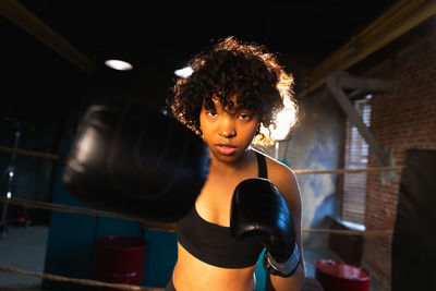 Side view of woman exercising in gym