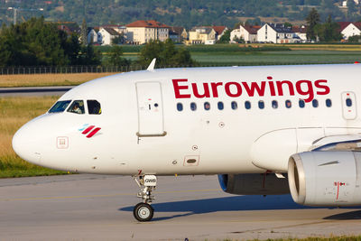 Close-up of airplane on airport runway