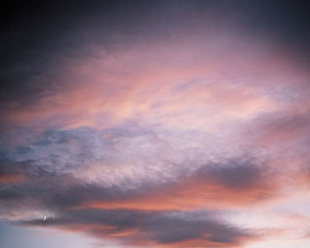 Low angle view of dramatic sky during sunset