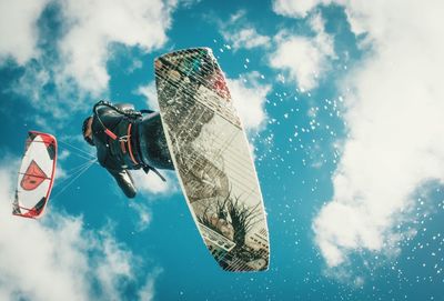 Low angle view of clothes hanging against sky