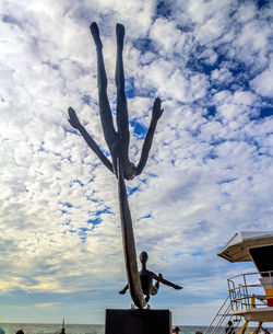 Low angle view of cactus plant against sky