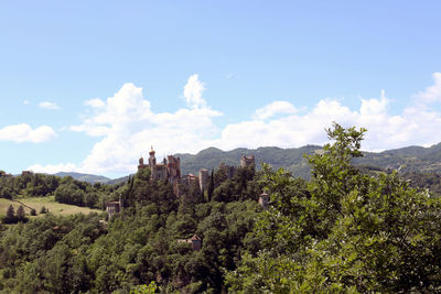 Panoramic view of trees on landscape against sky