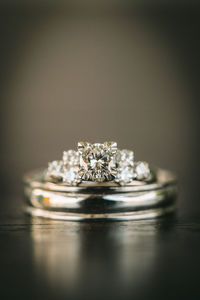 Close-up of wedding rings on table