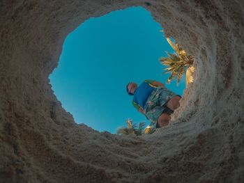 Low angle view of woman on beach