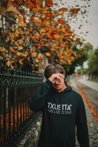 Man standing by plants during autumn