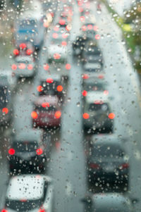 Cars on wet window in rainy season